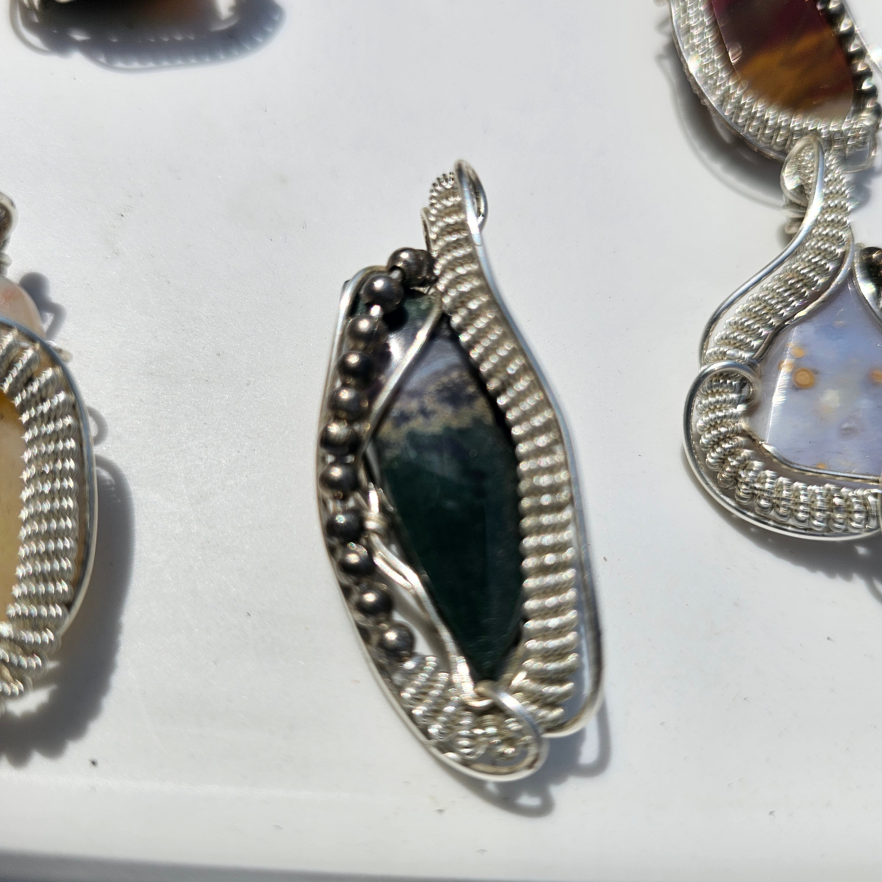 Hand wrapped pendent Moss Agate